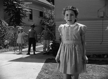 Movie still from “The Best Years of Our Lives” (1946), directed by William Wyler – A little girl standing in front of a house; Wide shot, Low angle