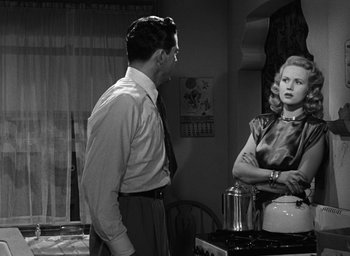 Movie still from “The Best Years of Our Lives” (1946), directed by William Wyler – A man and a woman standing in front of a stove; Medium shot, Over the shoulder angle