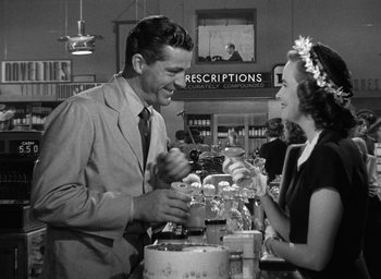 Movie still from “The Best Years of Our Lives” (1946), directed by William Wyler – A man and a woman at a bar with drinks in front of them; Medium shot, Over the shoulder angle