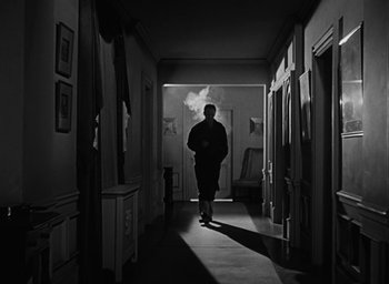 Movie still from “The Best Years of Our Lives” (1946), directed by William Wyler – A man walking down a hall way in a house; Wide shot, Low angle