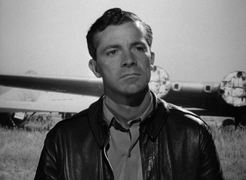 Movie still from “The Best Years of Our Lives” (1946), directed by William Wyler – Black and white photograph of a man wearing a leather jacket; Close Up shot, Low angle
