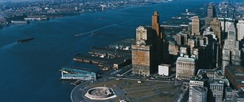 Movie still from “The Best of Everything” (1959), directed by Jean Negulesco – An aerial view of a city with a large building in the background; Extreme Wide shot, High angle