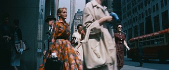 Movie still from “The Best of Everything” (1959), directed by Jean Negulesco – A group of people walking down a street; Wide shot, High angle