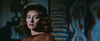 Movie still from “The Best of Everything” (1959), directed by Jean Negulesco – A person wearing a dress; Close Up shot, Over the shoulder angle