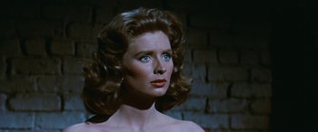 Movie still from “The Best of Everything” (1959), directed by Jean Negulesco – A person wearing a dress; Close Up shot, Over the shoulder angle