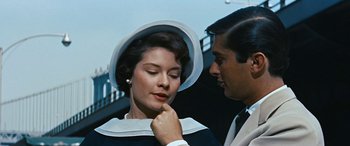 Movie still from “The Best of Everything” (1959), directed by Jean Negulesco – A man and a woman are looking at one another; Close Up shot, Low angle