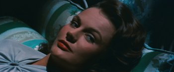 Movie still from “The Best of Everything” (1959), directed by Jean Negulesco – A woman's face in a dark room; Close Up shot, High angle