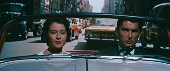 Movie still from “The Best of Everything” (1959), directed by Jean Negulesco – A man and a woman in the back seat of a car; Close Up shot, Over the shoulder angle