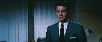 Movie still from “The Best of Everything” (1959), directed by Jean Negulesco – A man in a suit and a tie; Close Up shot, Over the shoulder angle