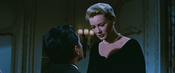 Movie still from “The Best of Everything” (1959), directed by Jean Negulesco – A man and a woman talking in front of a wall; Close Up shot, Low angle