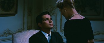Movie still from “The Best of Everything” (1959), directed by Jean Negulesco – A man and a woman are sitting in front of each other; Close Up shot, Over the shoulder angle