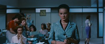 Movie still from “The Best of Everything” (1959), directed by Jean Negulesco – A group of women sitting in a room; Medium shot, Low angle