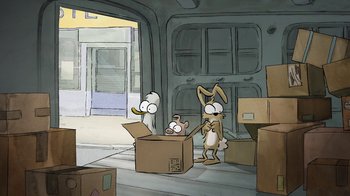 Movie still from “The Big Bad Fox and Other Tales” (2017), directed by Patrick Imbert – A couple of cartoon characters are in a box; Wide shot, High angle