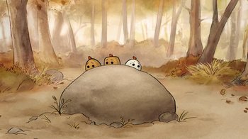 Movie still from “The Big Bad Fox and Other Tales” (2017), directed by Patrick Imbert – A group of people sitting on top of a rock in the woods; Extreme Close Up shot, Overhead angle