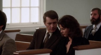 Movie still from “The Big Chill” (1983), directed by Lawrence Kasdan – A man and a woman sitting in a church pew; Medium shot, Over the shoulder angle