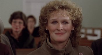 Movie still from “The Big Chill” (1983), directed by Lawrence Kasdan – A person with curly hair; Close Up shot, Over the shoulder angle