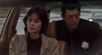 Movie still from “The Big Chill” (1983), directed by Lawrence Kasdan – A man and a woman sitting in the back of a car; Close Up shot, Over the shoulder angle