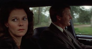 Movie still from “The Big Chill” (1983), directed by Lawrence Kasdan – A man and a woman sitting in the back of a car; Close Up shot, Over the shoulder angle