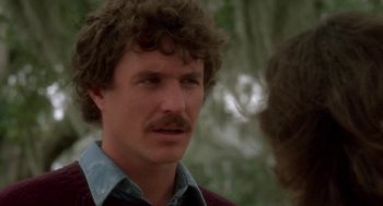 Movie still from “The Big Chill” (1983), directed by Lawrence Kasdan – A person with a mustache; Close Up shot, Over the shoulder angle
