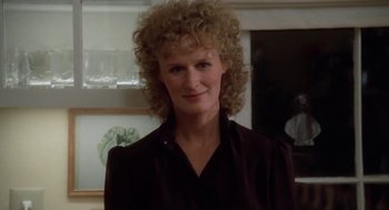 Movie still from “The Big Chill” (1983), directed by Lawrence Kasdan – A person with curly hair; Close Up shot, Over the shoulder angle