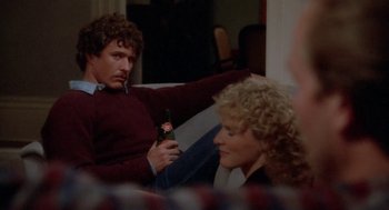 Movie still from “The Big Chill” (1983), directed by Lawrence Kasdan – A man and a woman sitting in a living room; Medium shot, Over the shoulder angle