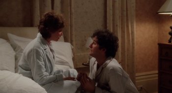 Movie still from “The Big Chill” (1983), directed by Lawrence Kasdan – A man and a woman sitting in a hospital bed; Medium shot, High angle