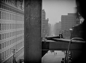 Movie still from “The Big Parade” (1925), directed by King Vidor – A view of a city from a building; Wide shot, Low angle