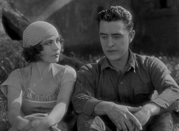 Movie still from “The Big Parade” (1925), directed by King Vidor – A man and a woman sitting next to each other; Medium shot, Low angle