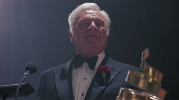 Movie still from “The Big Picture” (1989), directed by Christopher Guest – An older man wearing a tuxedo and a bow tie; Close Up shot, Low angle