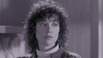 Movie still from “The Big Picture” (1989), directed by Christopher Guest – A black and white photo of a woman with curly hair; Close Up shot, Low angle