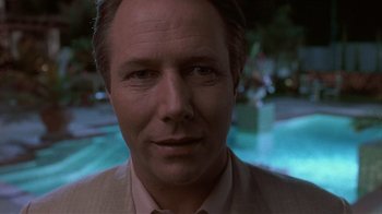 Movie still from “The Big Picture” (1989), directed by Christopher Guest – A person wearing a suit and tie; Close Up shot, Low angle