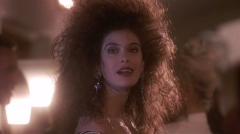Movie still from “The Big Picture” (1989), directed by Christopher Guest – A person with long hair; Close Up shot, Over the shoulder angle