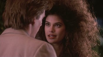 Movie still from “The Big Picture” (1989), directed by Christopher Guest – A man and a woman looking into each other's eyes; Close Up shot, Over the shoulder angle