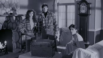 Movie still from “The Big Picture” (1989), directed by Christopher Guest – A man and a woman standing next to a boy; Medium shot, High angle