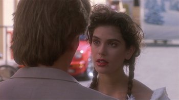 Movie still from “The Big Picture” (1989), directed by Christopher Guest – A young woman is talking to a young man outside; Close Up shot, Over the shoulder angle