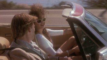 Movie still from “The Big Picture” (1989), directed by Christopher Guest – A man and a woman riding in the back of a car; Medium shot, Over the shoulder angle