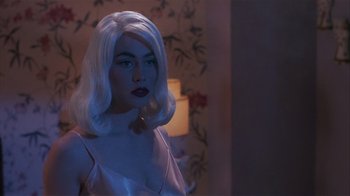 Movie still from “The Big Picture” (1989), directed by Christopher Guest – A woman with white hair and a white wig; Close Up shot, Over the shoulder angle