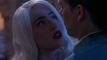 Movie still from “The Big Picture” (1989), directed by Christopher Guest – A man and a woman with long white hair and red lipstick; Close Up shot, Over the shoulder angle