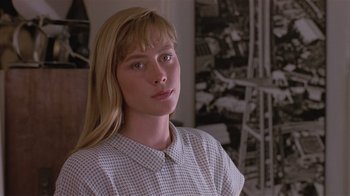 Movie still from “The Big Picture” (1989), directed by Christopher Guest – A woman with long blonde hair wearing a checkered shirt; Close Up shot, Low angle