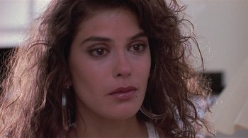 Movie still from “The Big Picture” (1989), directed by Christopher Guest – A person with long curly hair; Close Up shot, Over the shoulder angle