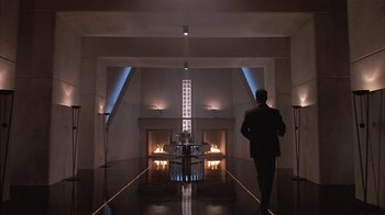 Movie still from “The Big Picture” (1989), directed by Christopher Guest – A man in a suit walking down a hall way; Extreme Wide shot, Low angle