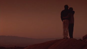 Movie still from “The Big Picture” (1989), directed by Christopher Guest – A man standing on top of a hill at night; Wide shot, Low angle