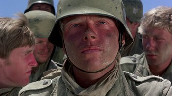 Movie still from “The Big Red One” (1980), directed by Samuel Fuller – A man in a helmet; Close Up shot, Low angle