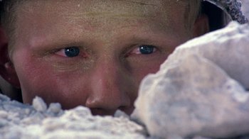 Movie still from “The Big Red One” (1980), directed by Samuel Fuller – A boy's face with blue eyes; Extreme Close Up shot, Overhead angle