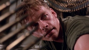 Movie still from “The Big Red One” (1980), directed by Samuel Fuller – A person wearing a green shirt; Close Up shot, Low angle