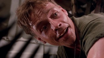 Movie still from “The Big Red One” (1980), directed by Samuel Fuller – A man's face covered in water; Close Up shot, Low angle