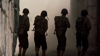 Movie still from “The Big Red One” (1980), directed by Samuel Fuller – A group of men standing next to each other in the fog; Wide shot, Low angle