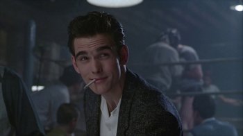 Movie still from “The Big Town” (1987), directed by Harold Becker – A man with a cigarette in his mouth; Close Up shot, Over the shoulder angle