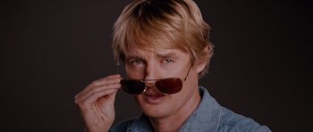 Movie still from “The Big Year” (2011), directed by David Frankel – A person wearing sunglasses; Close Up shot, Low angle