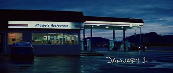 Movie still from “The Big Year” (2011), directed by David Frankel – A restaurant that is lit up at night time; Extreme Wide shot, Low angle